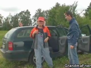 Old escort takes two dicks outdoor